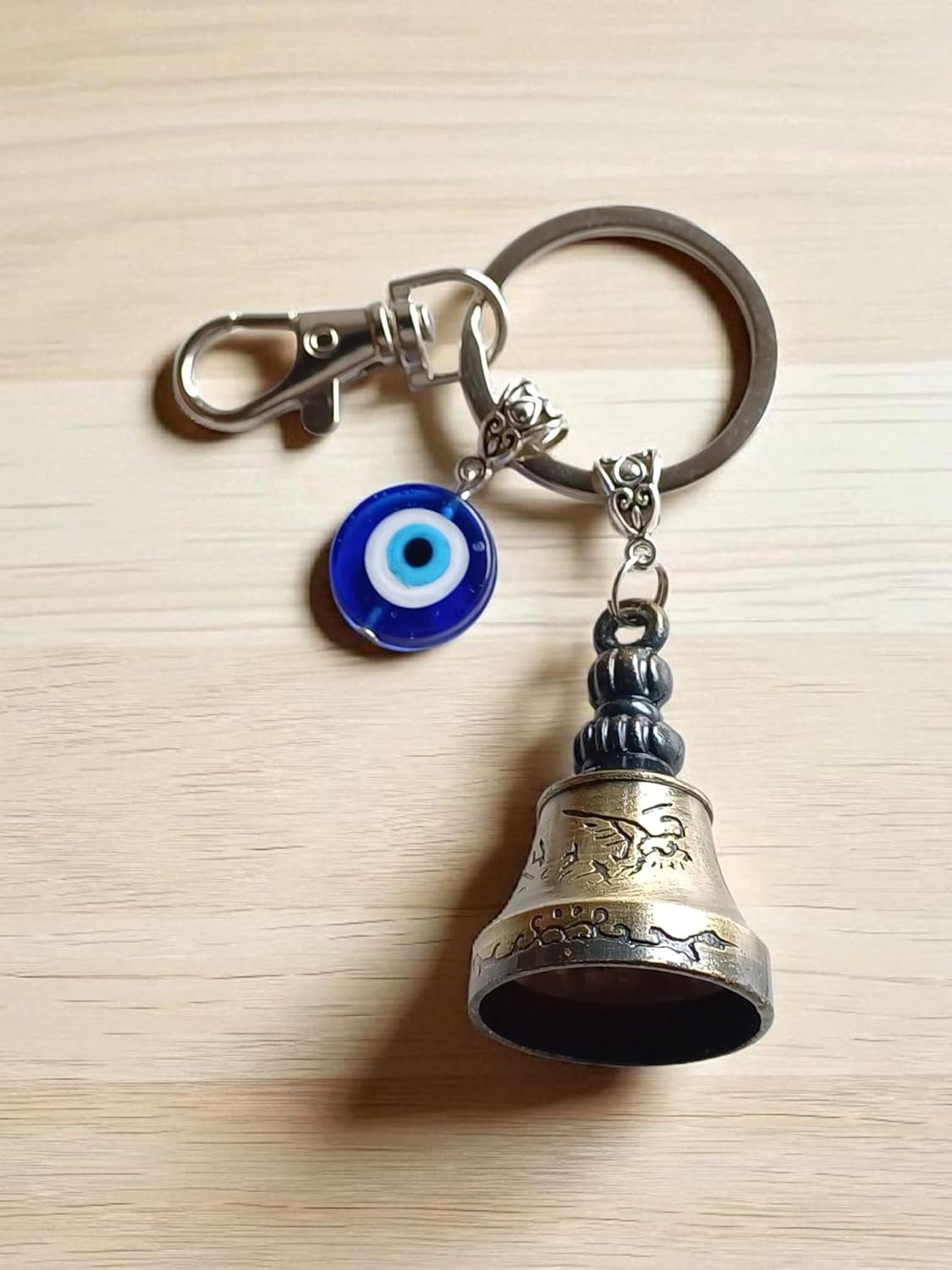 SHILPMART Guardian Golden Bell KeyChain Tibetan Decorative Temple Belll with Evil Eye & Black Hook Metal Keyring Good Luck Negative Energy Protection (Pack-1)